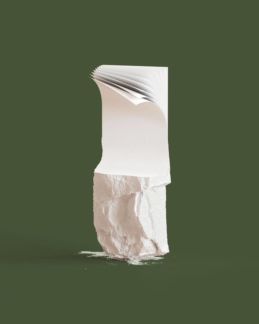 A conceptual image showing a sheet of stone paper emerging from a block of stone.